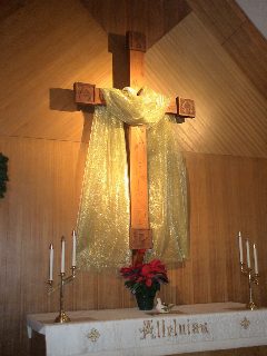 Left: Our large cross, decorated with gold cloth to symbolize the magnificence of the birth of Jesus.