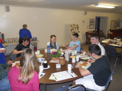 Some of our teen volunteer crew break for a meal of their own!