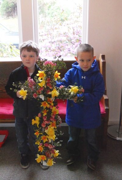 Aaron & Jeffrey carry in the flower cross in the procession!